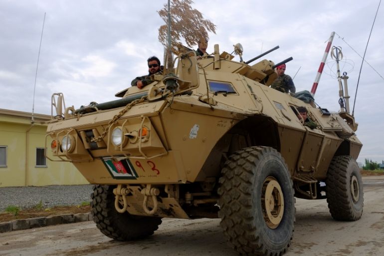 Afghan army troops in a Mobile Strike Force Vehicle return from a mission in Kunduz