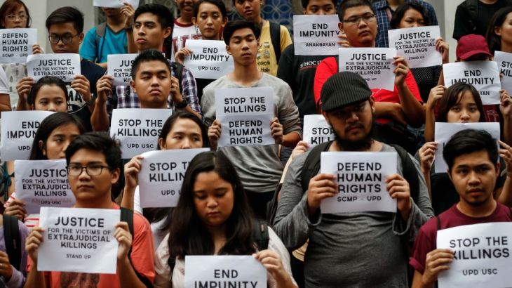 Students hold candle light protest against extrajudicial killings