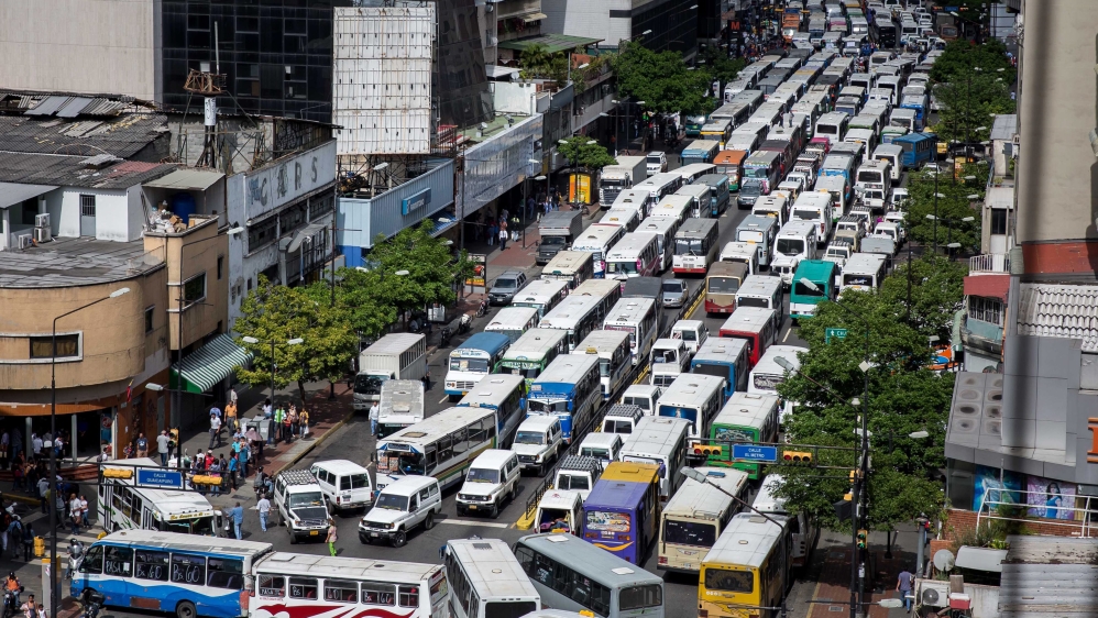 The protest paralysed half the bus fleet in Caracas, a city of three million people [EPA]