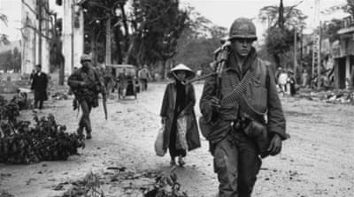 American soldiers and Vietnamese refugees returning to the town of Hue [Terry Fincher/Express/Getty Images] 