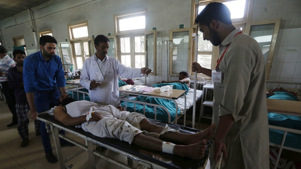 An injured man is treated at a hospital in Srinagar [Farooq Khan/EPA]