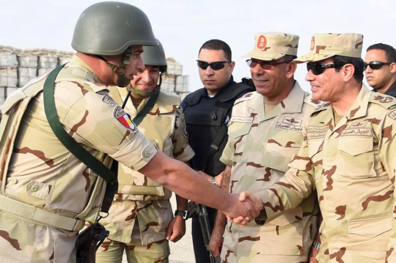 Egyptian President Sisi greets members of the Egyptian armed forces, after travelling to the troubled northern part of the Sinai peninsula to inspect troops