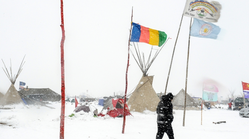 North Dakota's governor has claimed the wintry conditions will put the protesters' lives at risk [Stephanie Keith/Reuters]