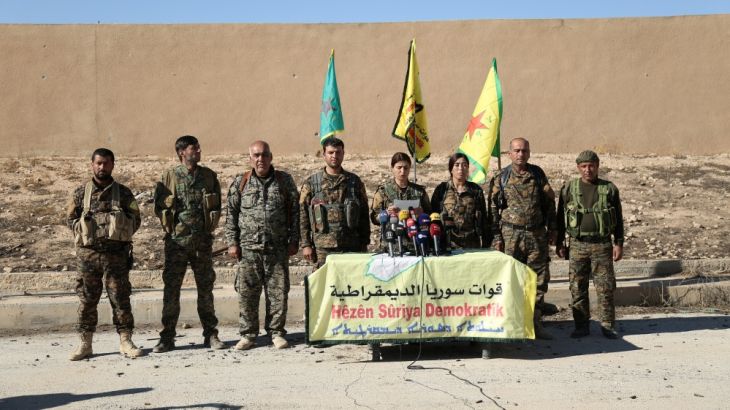 Syrian Democratic Forces commanders attend a news conference in Ain Issa