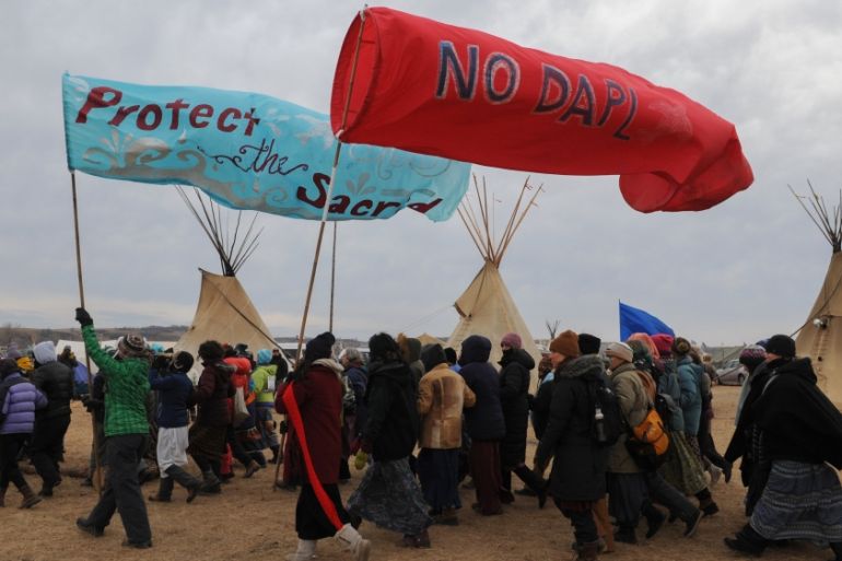 People march in Oceti Sakowin camp during a protest against plans to pass the Dakota Access pipeline near the Standing Rock Indian Reservation, near Cannon Ball, North Dakota, U.S.