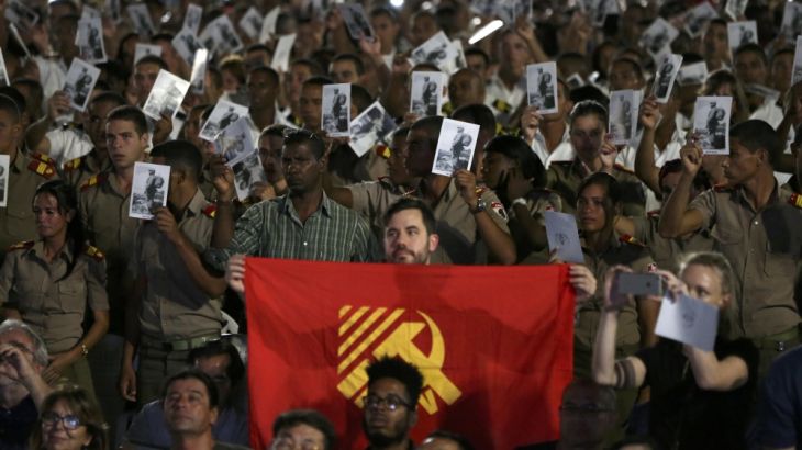 Cadets and sailors hold images of Cuba''s late President Fidel Castro as they pay tribute in Havana