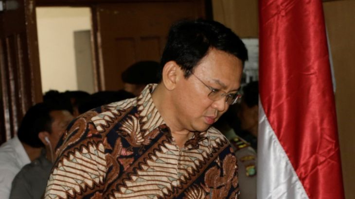 Jakarta Governor Basuki Tjahaja Purnama, popularly known as "Ahok", enters the courtroom before his trial hearing at North Jakarta District Court in Jakarta