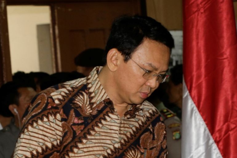 Jakarta Governor Basuki Tjahaja Purnama, popularly known as "Ahok", enters the courtroom before his trial hearing at North Jakarta District Court in Jakarta