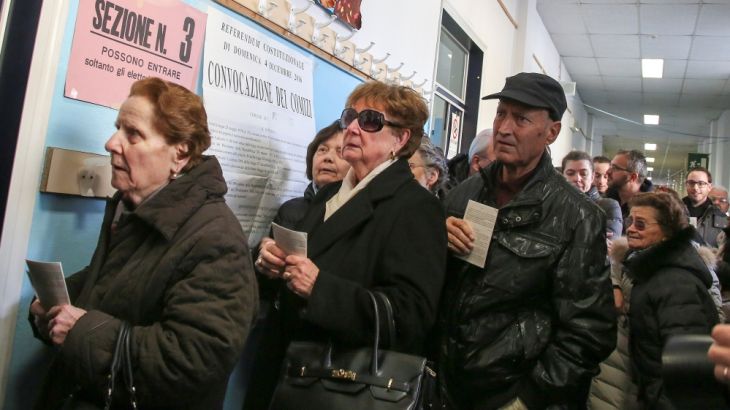 People wait to cast their votes for the referendum on constitutional reform, in Pontassieve