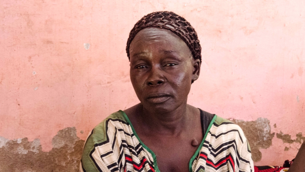 45-year old Mary Mario at Holy Family Church, Nazareth, Wau. Her husband Angelo Tadeo was murdered and her eight-year-old grandson, Wilson Angelo, was shot in the attacks on the town [Richard Nield/Al Jazeera]