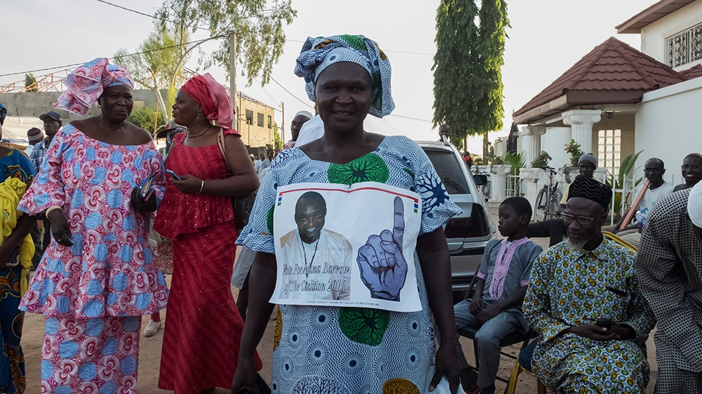 Supporters of president-elect Adama Barrow celebrate his election victory in the capital Banjul [Dimitris Chantzaras/SOOC/Al Jazeera] 