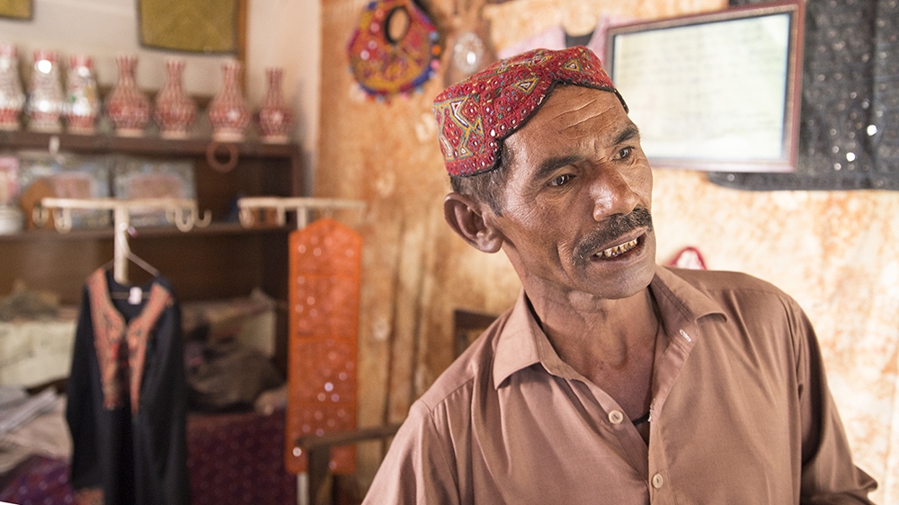 Ilyas works as a site attendant, shopkeeper, security guard and also makes replicas at home [Faras Ghani/Al Jazeera]