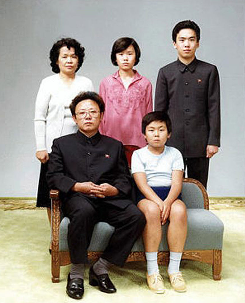 The late North Korean Kim Jong-il, bottom left, is seated beside his first-born son Kim Jong-nam [Getty Images]