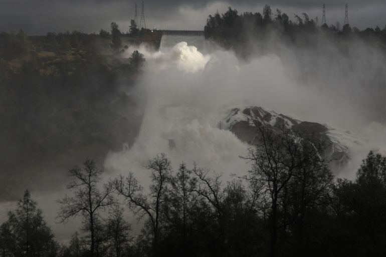 Water is released from the Lake Oroville Dam after an evacuation order was lifted for communities downstream from the dam in Oroville, California