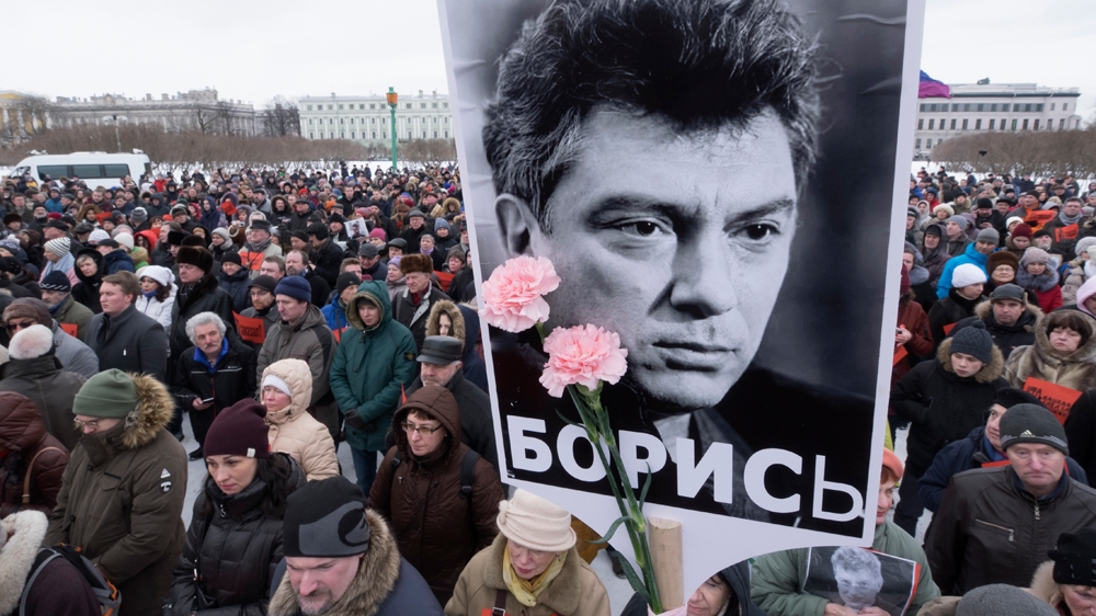 St Petersburg residents taking part in a February 2017 rally in memory of Nemtsov, portrait in centre [Dmitri Lovetsky/AP] 
