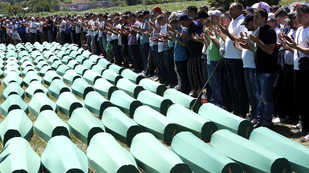 Bosnian Muslims pray during the funeral of the victims of the 1995 Srebrenica massacre, where more than 8,000 men and boys were executed [EPA]
