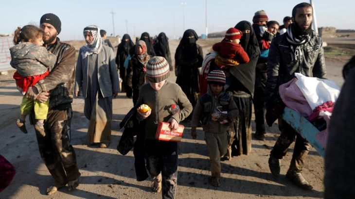 Displaced Iraqis flee their homes in western Mosul