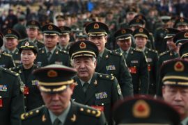 Military delegates arrive before the opening of the fifth Session of the 12th National People's Congress outside the Great Hall of the People in Beijing, on March 5 [EPA]