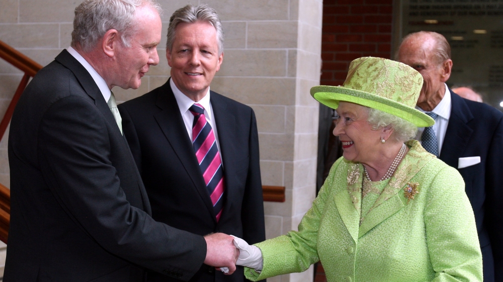 Britain's Queen Elizabeth II shaking hands with former Northern Ireland Deputy First Minister Martin McGuinness on her arrival at the Lyric Theatre in Belfast, Northern Ireland in June 2012 [Paul Faith/EPA]