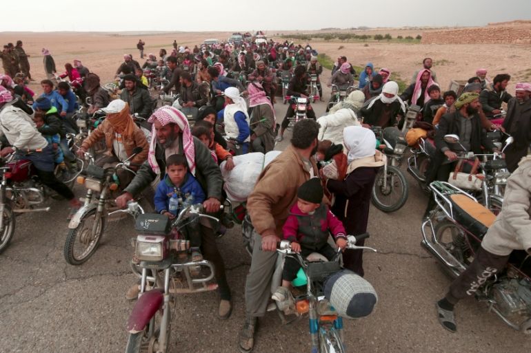 People fleeing from areas surrounding Euphrates River dam, east of Raqqa city, ride their motorcycles towards Syrian Democratic Forces (SDF) controlled areas, Syria