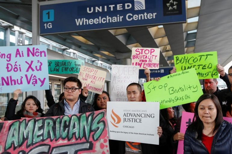 People protest a passenger being forcibly removed from a United Airlines flight at O''Hare International Airport in Chicago