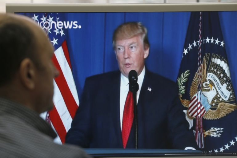 Russians watch US President Donald J. Trump announcing US strikes in Syria