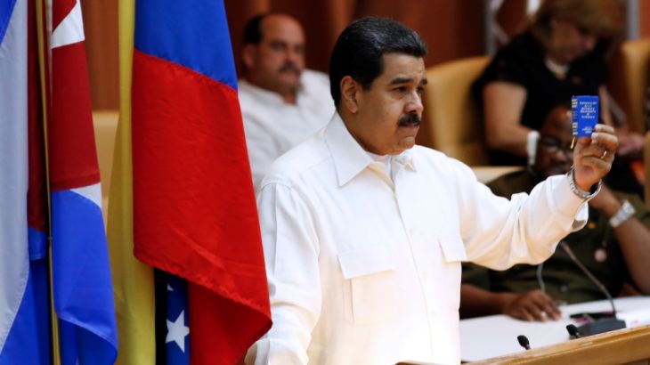 Venezuela''s President Nicolas Maduro holds the Venezuela''s constitution as he speaks during the XV ALBA-TCP, in Havana, Cuba