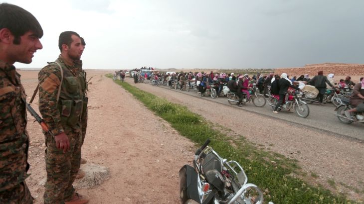 People who fled from areas surrounding Euphrates River dam, east of Raqqa city, ride motorcycles towards Syrian Democratic Forces(SDF) controlled areas
