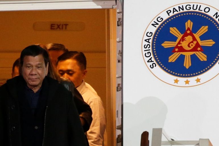 Philippine President Rodrigo Duterte disembarks from a plane upon his arrival at Vnukovo International Airport in Moscow