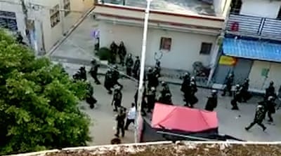 Amateur footage shows police on the streets of Wukan on September 13, 2016 [Screengrab/Al Jazeera]