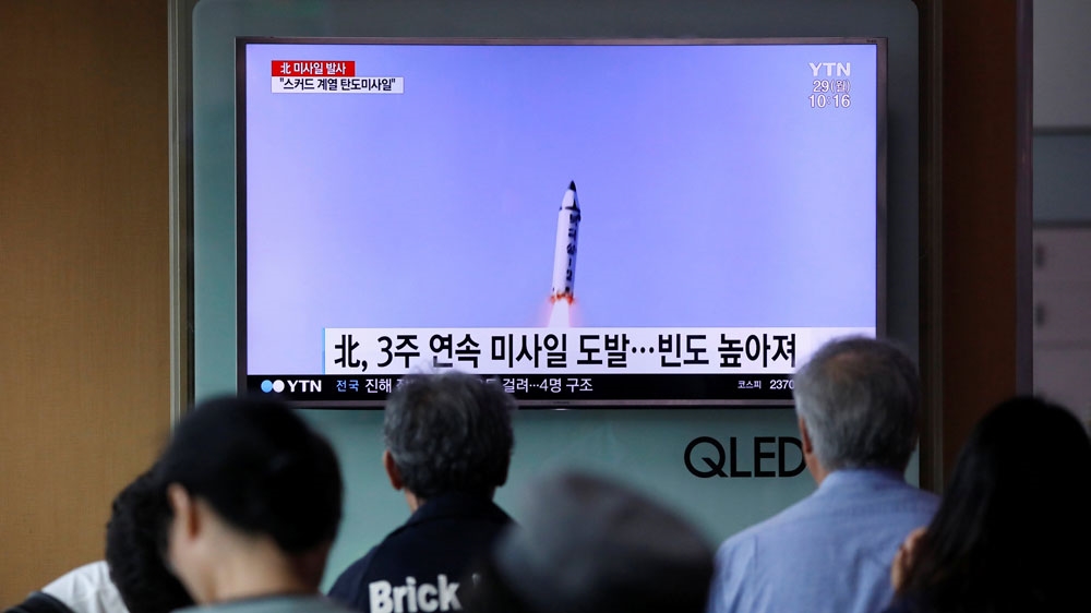 South Koreans watched a news report on the North Korean missile test in Seoul [Kim Hong-Ji/Reuters]