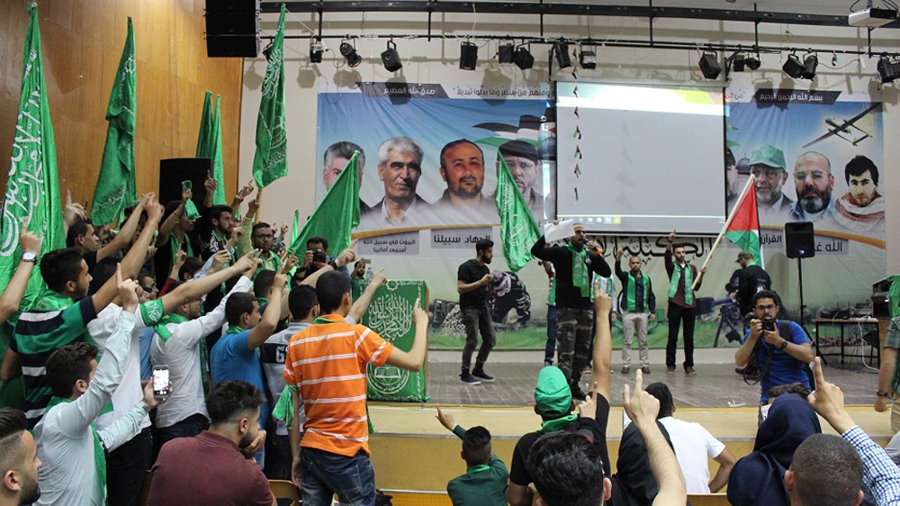 Members of the Islamic bloc, the Hamas-affiliated student party, speak at an election event at Birzeit University [Nigel Wilson/Al Jazeera]