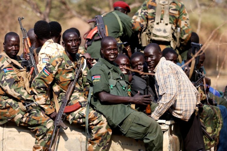 FILE PHOTO - South Sudan''s rebels with weapons travel in a truck in a rebel-controlled territory in Jonglei State