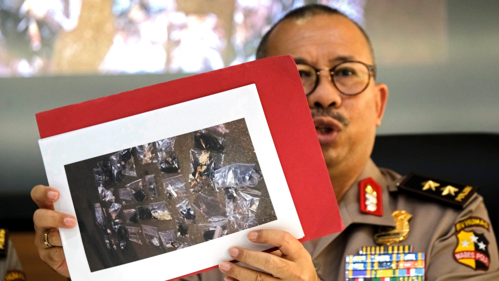 Indonesian police spokesman Setyo Wasisto shows a picture of evidence collected from the blast site [Reuters]