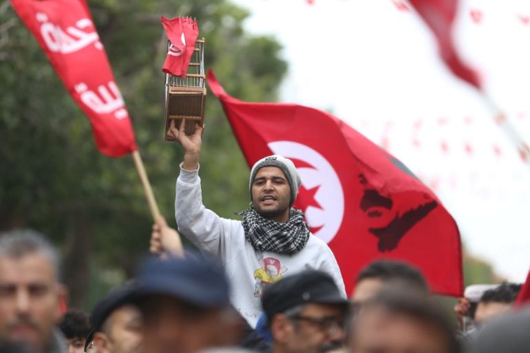 People attend celebrations marking the sixth anniversary of Tunisia''s 2011 revolution in Habib Bourguiba Avenue in Tunis