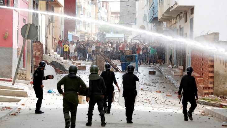 Moroccan police fires water cannon at protesters demonstrating against alleged corruption in the provincial town of Imzouren