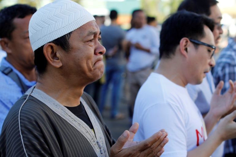 A Muslim man weeps while praying outside a mosque inside city hall compound as government forces continue their assault against insurgents from the Maute group Marawi City