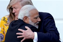 India's Prime Minister Narendra Modi hugs US President Donald Trump after a visit to the White House [Carlos Barria/Reuters]