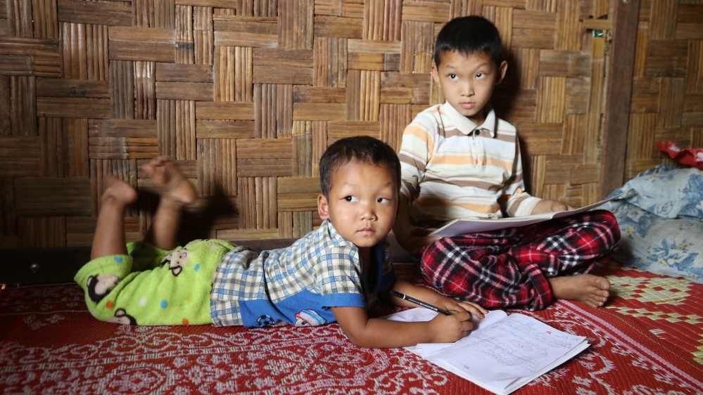  Aung Latt and his little brother Naw Aung, live in a camp for displaced people in Myanmar's Kachin state [Ingrid Prestetun/NRC]