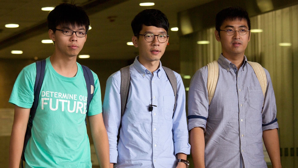 Joshua Wong (left), Nathan Law (centre) and Alex Chow were jailed in 2017 [The Associated Press]