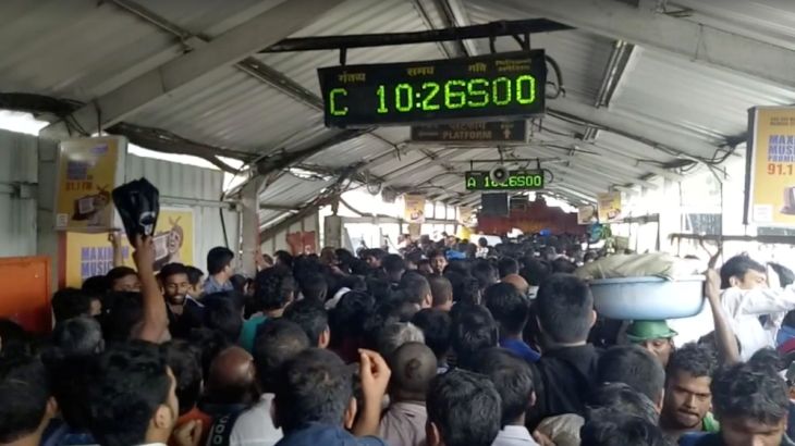 Crowds of commuters move along Elphinstone railway station bridge in Mumbai