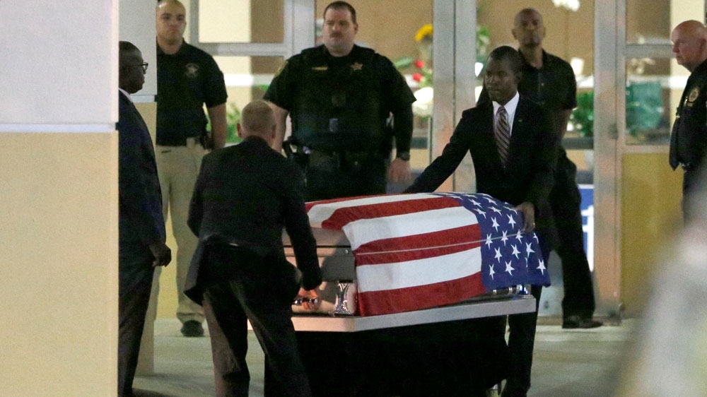 After a public viewing, the coffin of Army Sergeant La David Johnson, was taken from Christ The Rock Church in Cooper City, Florida [Joe Skipper/Reuters]