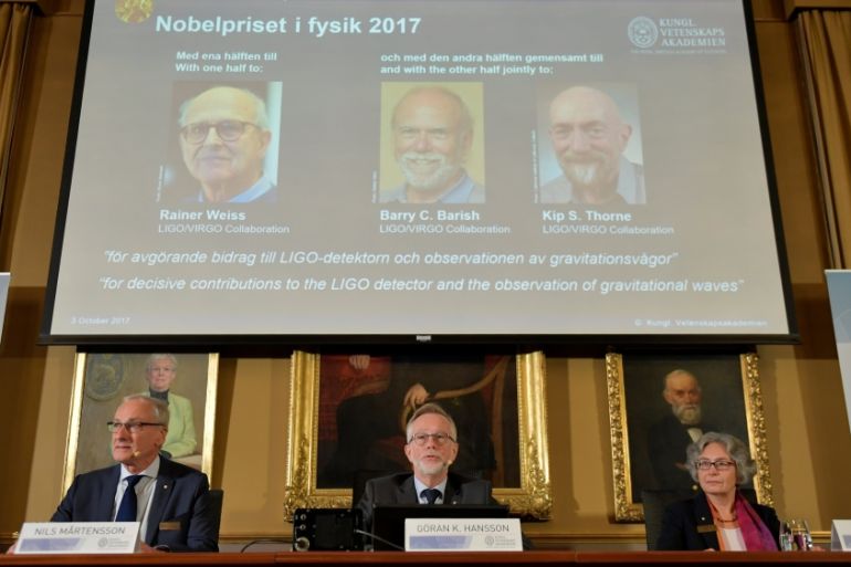 The names of Rainer Weiss, Barry C. Barish, Kip S. Thorne are displayed on the screen during the announcement of the winners of the Nobel Prize in Physics 2017, in Stockholm