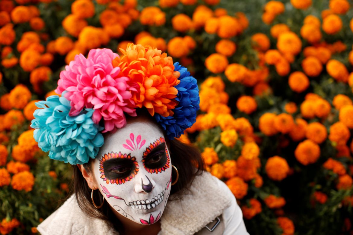 A woman dressed up as "Catrina", a Mexican character also known as "The Elegant Death", takes part in a Catrinas parade in Mexico City, Mexico October 22, 2017. REUTERS/Carlos Jasso TPX IMAGES OF THE