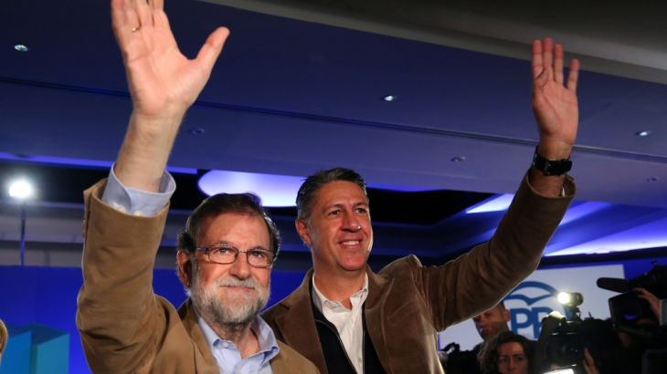 Spanish Prime Minister Mariano Rajoy and Catalan People''s Party (PP) president Xavier Garcia Albiol wave as they arrive at a Catalan regional People''s Party meeting in Barcelona
