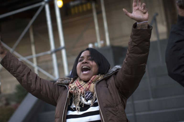 Erica Garner, the daughter of Eric Garner leads a chant at a protest and candlelight vigil outside the 120th police precinct in the Staten Island borough of New York City