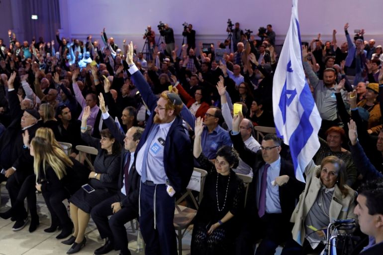 Likud party members vote during a Likud Central Committee meeting in Airport City