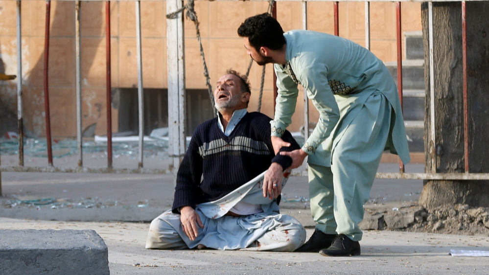 A man reacts after hearing his son was killed during Saturday's car bomb attack in Kabul [Omar Sobhani/Reuters]
