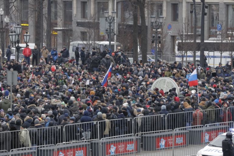 People gather in a square during a rally of supporters of Russian opposition leader Navalny in Moscow