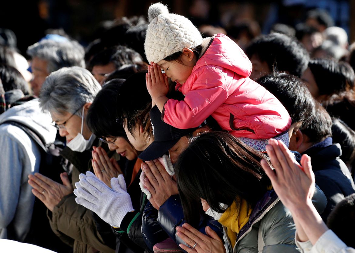 People offer prayers on the first day of the new year at the Meiji Shrine in Tokyo, Japan. January 1, 2018. REUTERS/Toru Hanai
